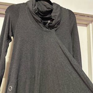 Grey long sleeve dress material is stretchy